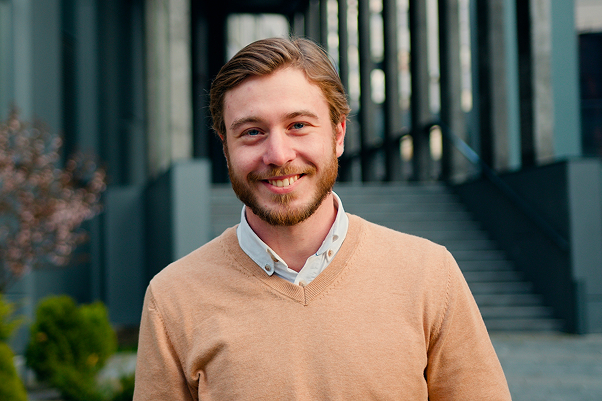 man infront of building
